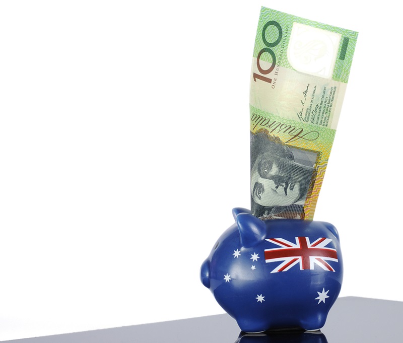 Australian money one hundred dollar note in red white and blue piggy bank with Australian flag for 30th June End of Financial Year Australian economy or savings concept.