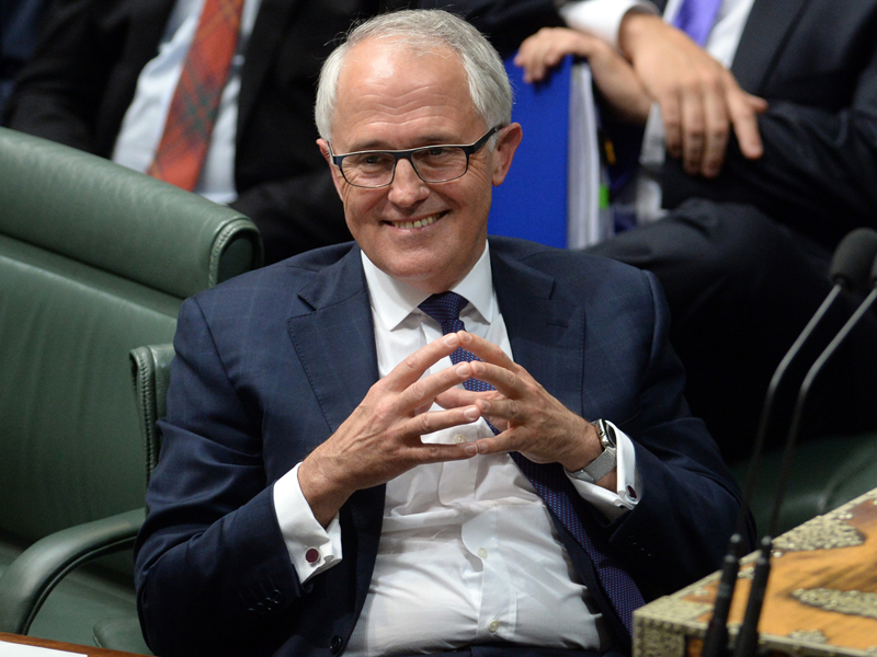 Australian Prime Minister Malcolm Turnbull (centre) reacts during Question Time in the House of Representatives at Parliament House in Canberra, Tuesday, Sept. 15, 2015. Turnbull was sworn in this afternoon after winning the Australian Federal Leadership in a party ballot vote. (AAP Image/Sam Mooy) NO ARCHIVING